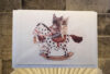 Frenchie on rocking horse