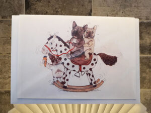 Frenchie on rocking horse