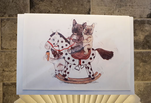 Frenchie on rocking horse